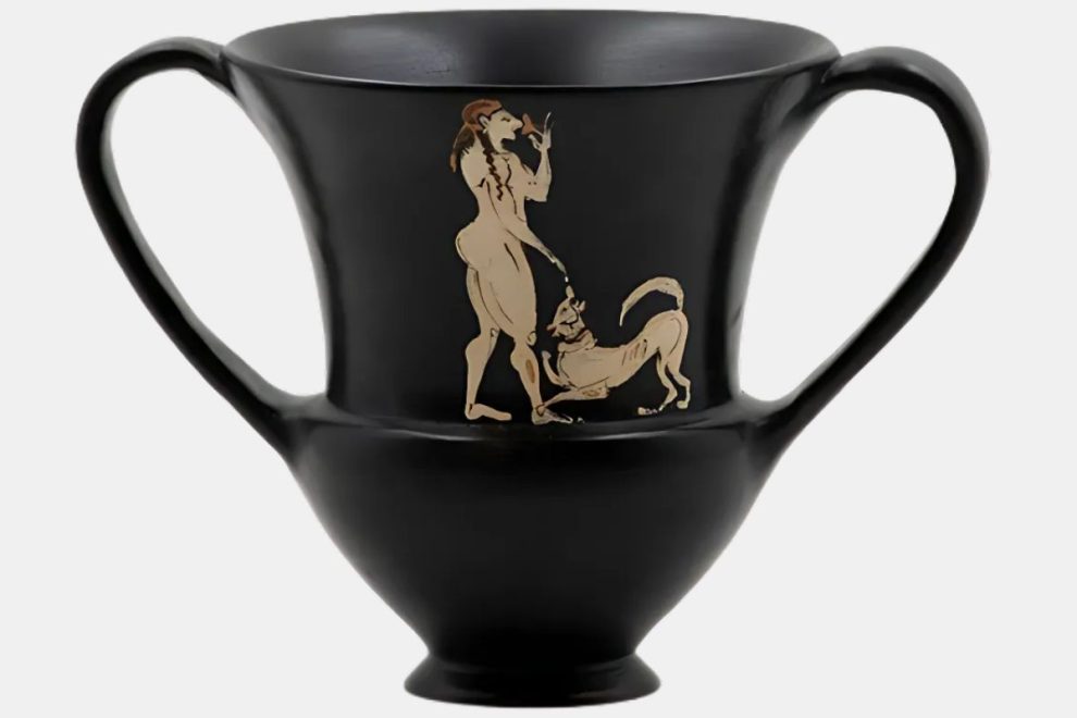 A black two-handled vessel showing a terracotta figure and a dog in an Ancient Greek style.